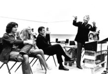 Bernstein-MASS-1971-rehearsal-with-Alan-Titus-Joan-and-Ted-Kennedy-and-Leonard-Bernstein-by-Fletcher-Drake_Courtesy-of-the-Kennedy-Center-Archives-scaled.jpg