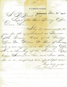 Photo of a yellowed letter, a document with black text written in script.