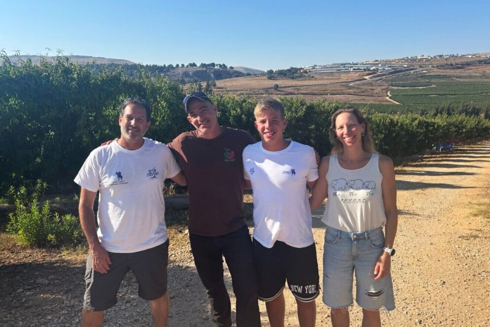 Four people standing outdoors