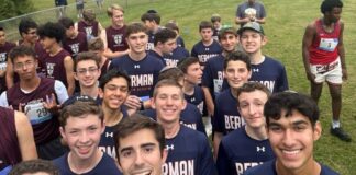 Photo of high school-age boys in navy blue uniforms that read "Berman" in all caps.
