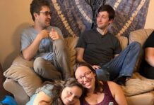 New Moishe House Opens in Adams Morgan Photo of four young adults: two seated on a couch and two seated on the floor in front of them. They are smiling at the camera.