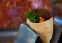 Shouk Closes Last Two Locations in DC, Rockville Stock photo of a falafel pita with green vegetables.