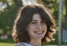 Ella Messler Upholds Democracy, Jewish Advocacy With the Nexus Project Headshot of a young girl with chin-length wavy brown hair. She is smiling at the camera and wearing a white sleeveless top.