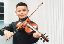 Youssef Sarhan, a 9-year-old violinist from Majd al-Krum, participates in The Jerusalem Orchestra East & West’s youth initiative.