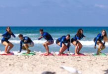 At New Netanya Surf Therapy Center, Israelis Learn to Fall and Get Back Up Participants in a HaGal Sheli surf therapy program during a session.