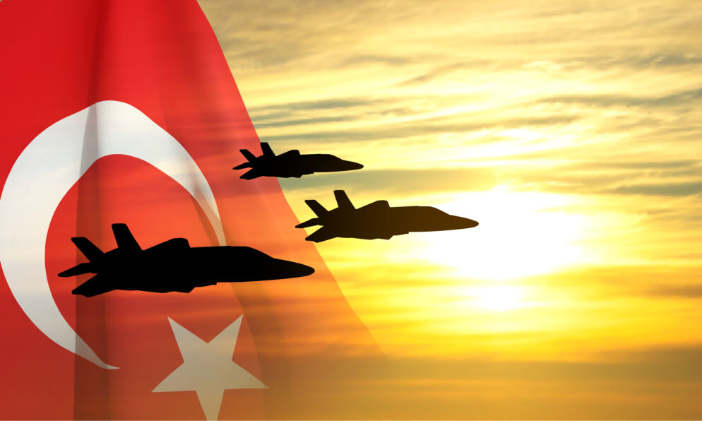 Military aircraft against the sunset and Turkey flag.
