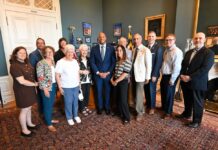Gov. Wes Moore with volunteers who brought thank you petitions.