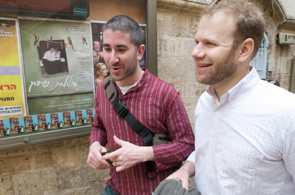 Michael Solomonov and Steven Cook talk while walking through streets of Israel. Photo courtesy of Zahav