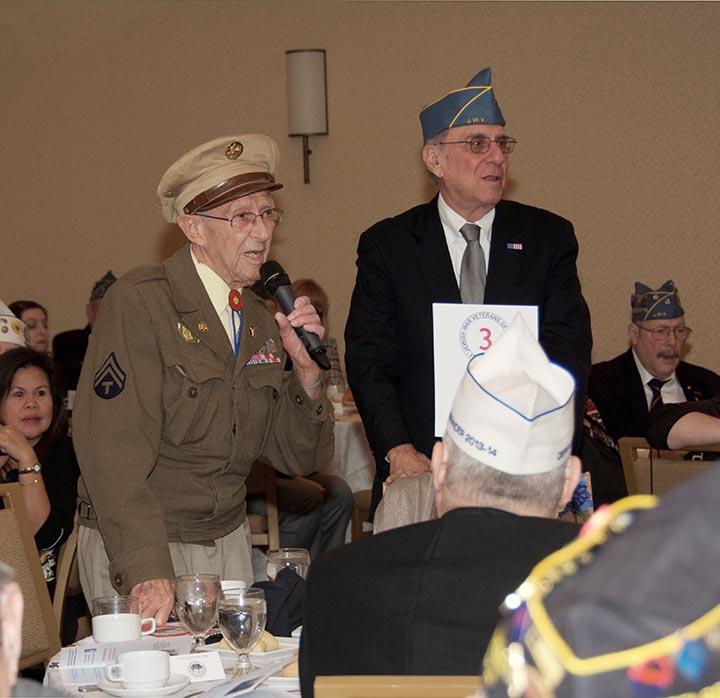 Ben Cooper, left, shares his thoughts about his role as a liberator, while wearing part of his original uniform, on Feb. 13 in Crystal City at a Jewish War Veterans of the USA celebration honoring the liberators of Nazi concentration camps.Photo courtesy of The Jewish War Veterans of the USA 