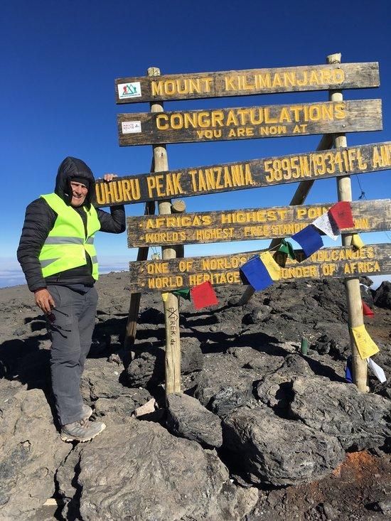 King of the wild frontier: Phil Lehman of Silver Spring climbed through five climate zones to reach the peak of Kilimanjaro in August. Photo courtesy of Phil Lehman 