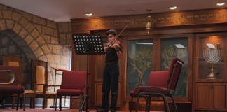 Ze'ev Goldstein, 11, performs at the Jewish Orchestra of Youth kickoff event.
