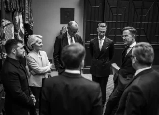 A group of men and women standing in a circle.