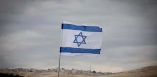 A blue and white Israeli flag.