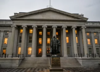 A large, gray building with pillars.